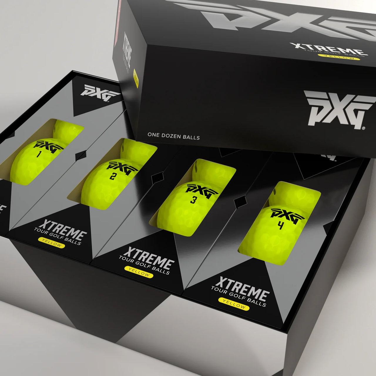 PXG Xtreme golf balls packaging with yellow balls and black boxes on a light gray background