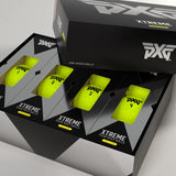 PXG Xtreme golf balls packaging with yellow balls and black boxes on a light gray background